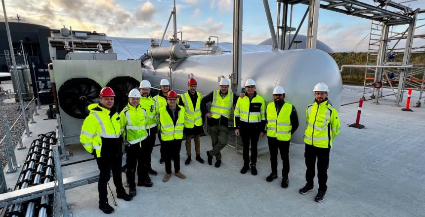 Stiesdal Hydrogen’s management and engineers in front of an installed HydroGen Electrolyzer